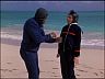 T.C. (Roger E. Mosley) & Rick (Larry Manetti)