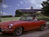 Magnum (Tom Selleck) in a Jaguar E-Type Series 1 Roadster